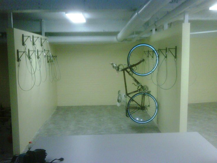If the room is large enough consider adding a bike wall in the middle of the room. Fill out our complimentary bike room layout form. We will help you create a space efficient bike room for maximum storage. 